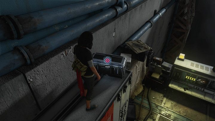 Przeskocz na kolejna platformę, otwórz skrzynię na metalowej szafie i spróbuj uruchomić dużych rozmiarów elektroniczne urządzenie, które stoi poniżej - Marvels Avengers: W poszukiwaniu Olimpii/To find Olympia - solucja - Marvels Avengers - poradnik do gry