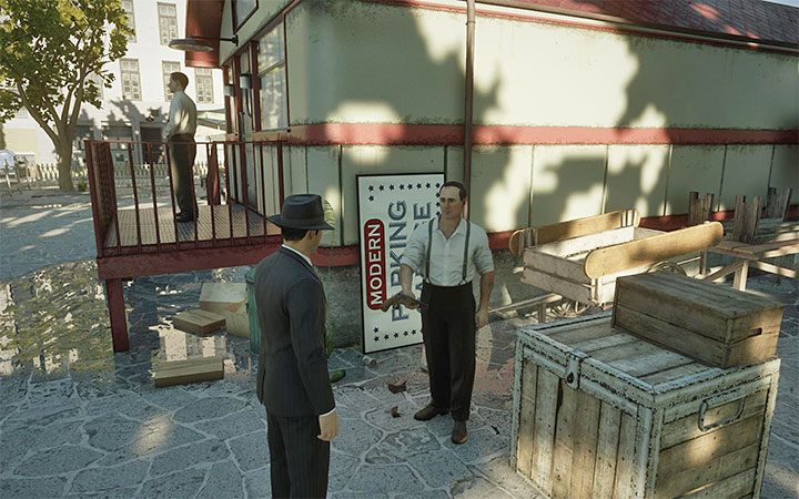 Vincenzo stoi niedaleko miejsca, w którym Tommy na samym początku misji odbył rozmowę z Salierim - Mafia Definitive Edition: Omerta - solucja - Mafia 1 Definitive Edition - poradnik, solucja