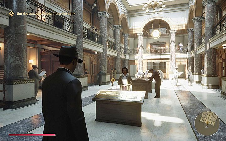 15) Grand Imperial Bank - Budynek banku po raz pierwszy odwiedza się w końcowej części głównej misji Omerta, przy czym odgrywa on zdecydowanie ważniejszą rolę w zadaniu Robota na boku - Mafia Definitive Edition: Mapa świata - Lost Haven - Mafia 1 Definitive Edition - poradnik, solucja