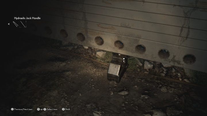 Uchwyt hydrauliczny umieść w podnośniku, dzięki niemu otworzysz sobie wyjście z garażu - The Medium: Warsztat - solucja, opis przejścia - The Medium - poradnik do gry