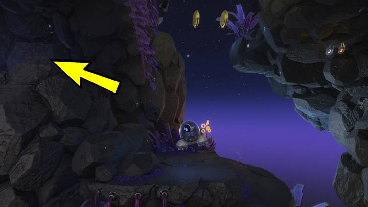 Podążaj wzdłuż skał i nie przegap jaskini po lewej stronie - Astros Playroom: Jaskinie buforowania - solucja, opis przejścia - Astros Playroom - poradnik do gry