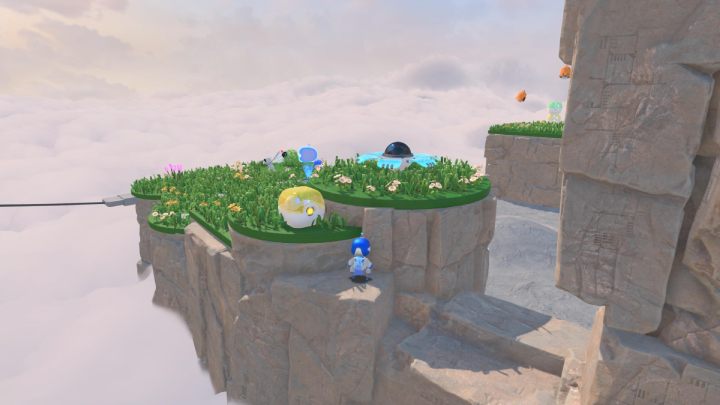 Wejdź po schodach i zbierz monety z żółtego pojemnika - Astros Playroom: Wietrzna brama - solucja, opis przejścia - Astros Playroom - poradnik do gry