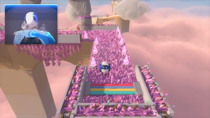 Przeturlaj się z szarych platform z powrotem na różową trawę i jedź wzdłuż ścieżki w lewo - Astros Playroom: Pola szybkości - solucja, opis przejścia - Astros Playroom - poradnik do gry