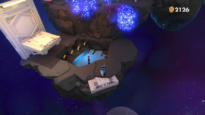 Przeskocz przez okrągłą platformę na następną skałę - Astros Playroom: Głęboka przestrzeń danych - solucja, opis przejścia - Astros Playroom - poradnik do gry