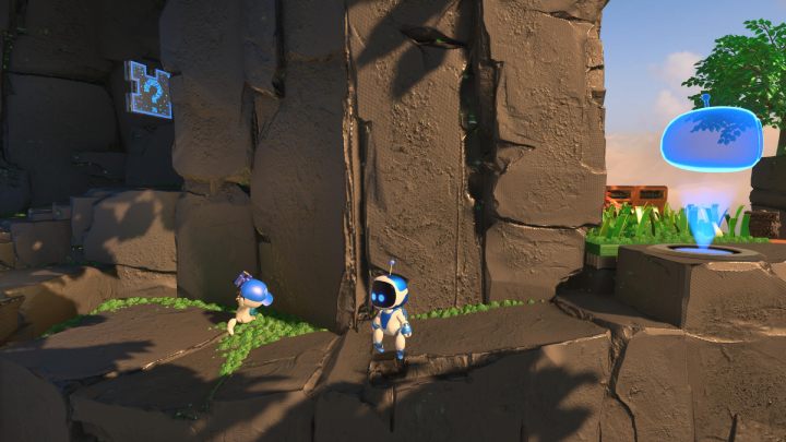 Przeskocz z platformy do punktu kontrolnego i zajrzyj do ukrytej jaskini po lewej stronie - Astros Playroom: Ruiny raytrace - solucja, opis przejścia - Astros Playroom - poradnik do gry