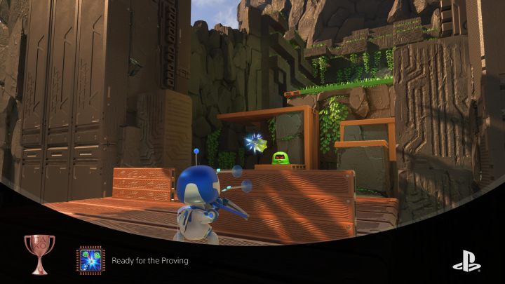 Wejdź na most i chowając się za drewnianą osłoną zestrzel wszystkich wrogów - Astros Playroom: Ruiny raytrace - solucja, opis przejścia - Astros Playroom - poradnik do gry