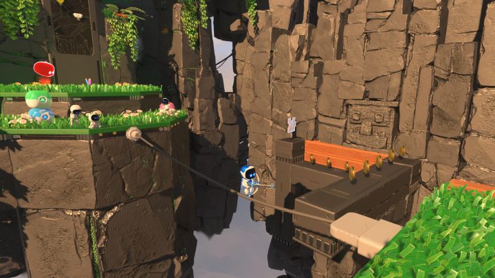 Zeskocz z kabla na szarą, podłużną platformę i zabierz 4 element układanki - Astros Playroom: Ruiny raytrace - solucja, opis przejścia - Astros Playroom - poradnik do gry