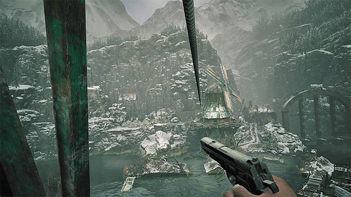 Skorzystajcie z nowej drabiny i po wspięciu się na górę musicie rozpocząć długi zjazd na linie - Resident Evil Village: Przeprawa przez zbiornik, unikanie ryby - solucja - Resident Evil Village - poradnik do gry