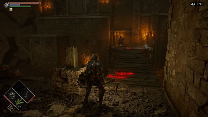 Jak widać na zdjęciu, początkowo drewniany most stworzony z desek prowadzi do oficjela, jednakże wchodząc na niego, spadniecie na dół - Demons Souls Remake: Kuźnie (2-1) - solucja, opis przejścia - Demons Souls Remake - poradnik do gry