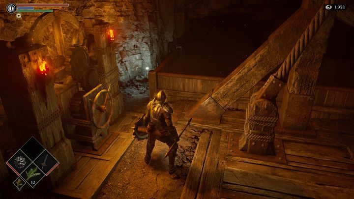 Przy uchwycie znajduje się materiał potrzebny do ulepszania broni - Demons Souls Remake: Kuźnie (2-1) - solucja, opis przejścia - Demons Souls Remake - poradnik do gry