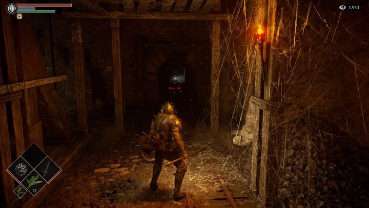 Będąc na dole, po lewej stronie znajduje się ciemny korytarz - Demons Souls Remake: Kuźnie (2-1) - solucja, opis przejścia - Demons Souls Remake - poradnik do gry