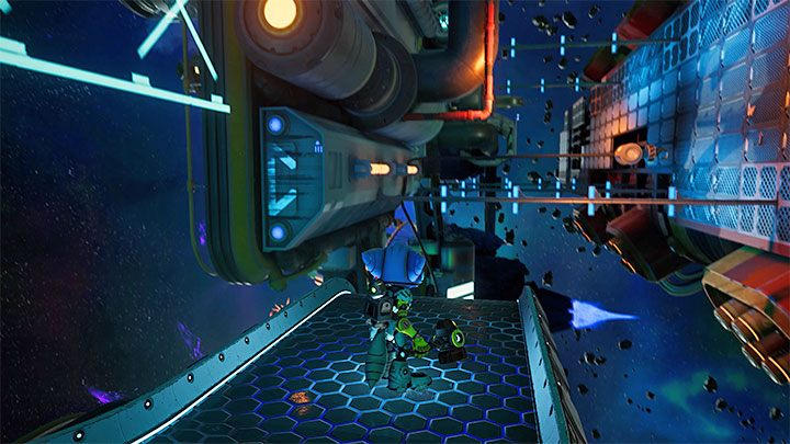 Sekret możecie zdobyć niedaleko miejsca, w którym rozpoczynacie eksplorację Chmury Szczątków Scarstu - Ratchet & Clank Rift Apart: Chmura Szczątków Scarstu - znajdźki, lista, mapa - Ratchet & Clank Rift Apart - poradnik do gry