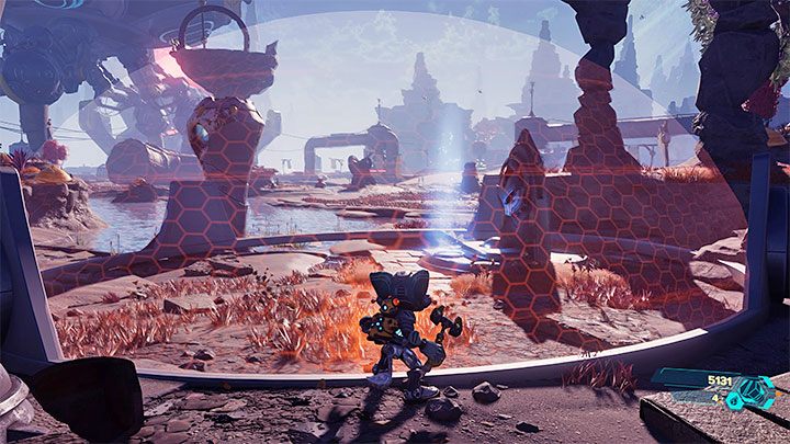 Kapliczka jest w południowo-zachodniej części pustkowi - Ratchet & Clank Rift Apart: Zdobycie wiedzy lombaków - solucja, kapliczki - Ratchet & Clank Rift Apart - poradnik do gry