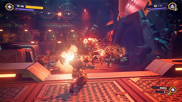 Po zakończonych walkach wyruszcie w stronę oznaczonego przez grę przejścia - Ratchet & Clank Rift Apart: Wyłączenie reaktora - solucja - Ratchet & Clank Rift Apart - poradnik do gry
