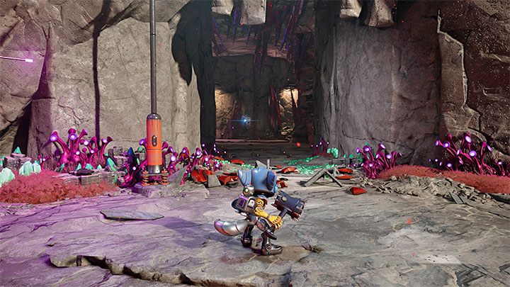 Poszukiwane boty naukowe są w różnych częściach obszaru na zachód od miejsca pobytu głównego inżyniera, przy czym dociera się do nich w ustalonej kolejności - Ratchet & Clank Rift Apart: Spotkanie z inżynierem, poszukiwania botów - solucja - Ratchet & Clank Rift Apart - poradnik do gry