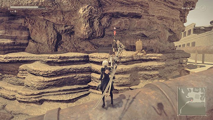 Na pustynię (Desert Zone) dociera się od strony ruin miasta (City Ruins) i po drodze musicie skorzystać z wąskiego przejścia pod przekrzywionymi wieżowcami - NieR Automata: 3 Rozdział, Route A - solucja, opis przejścia - NieR Automata - poradnik do gry