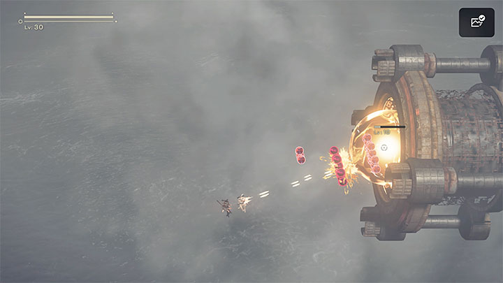 Po zniszczeniu wszystkich mniejszych rdzeni odsłonięty zostanie główny generator EMP i będziecie mogli przystąpić do ostrzeliwania go - NieR Automata: 7 Rozdział, Route A - solucja, opis przejścia - NieR Automata - poradnik do gry