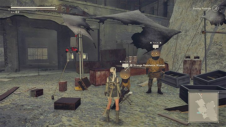 W obozie rebeliantów odszukajcie NPC-a Strange Resistance Woman - NieR Automata: Sklep z trofeami - jak odblokować? - NieR Automata - poradnik do gry