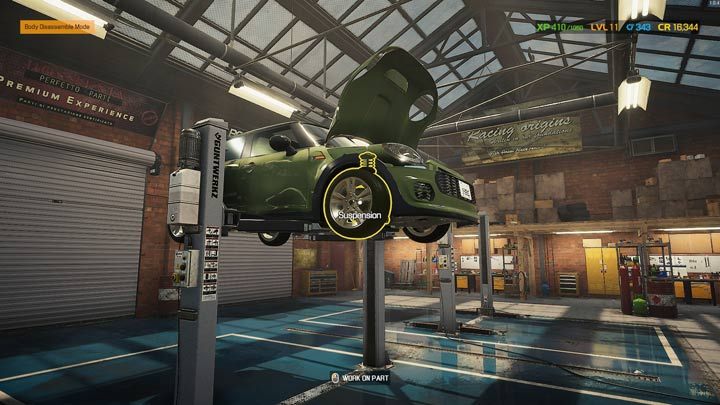 Uniesione auto zapewnia dostęp do zawieszenia z przodu oraz tyłu - Car Mechanic Simulator 2021: Wymiana części - Car Mechanic Simulator 2021 - poradnik do gry