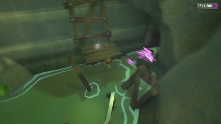 Przed wejściem do opuszczonej jaskini musicie zeskoczyć na niższy kamień, a z niego na metalową poręcz - Psychonauts 2: PSI Challenge Card, The Quarry - gdzie znaleźć? - Psychonauts 2 - poradnik do gry