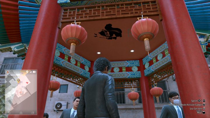 15 obrazek znajduje się przed restauracją w Chinatown - Lost Judgment: Squirrel search Chinatown - wszystkie wiewiórki, mapa - Lost Judgment - poradnik do gry