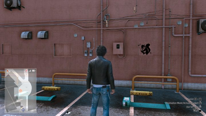 18 obrazek znajduje się na ścianie przy parkingu w dzielnicy Bar District - Lost Judgment: Squirrel search Bar District - wszystkie wiewiórki, mapa - Lost Judgment - poradnik do gry