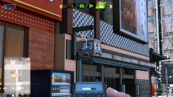 Użyjcie detektora, aby odnaleźć księgę The Walkin, Talkin Hermit na lampie restauracji - Lost Judgment: Squirrel search Theater - wszystkie wiewiórki, mapa - Lost Judgment - poradnik do gry