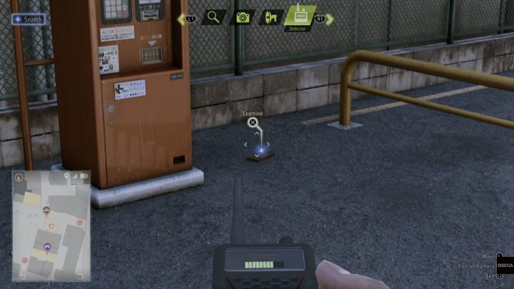 Przy użyciu detektora zbadajcie portfel leżący na parkingu - Lost Judgment: Dastardly Detective The Eavesdropping Wallet - solucja - Lost Judgment - poradnik do gry