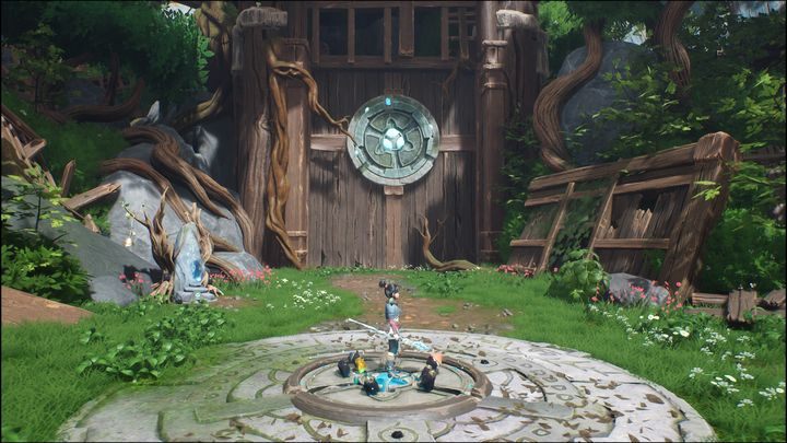 Musicie przejść duży obszar, idąc przed siebie, aż dojdziecie do wielkiej, drewnianej bramy z kryształem umiejscowionym w centrum - Kena Bridge of Spirits: Help the Woodsmith - solucja, opis przejścia - Kena Bridge of Spirits - poradnik do gry