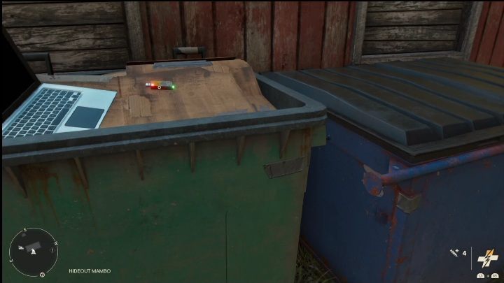 Pendrive znajdziecie w dużym koszu na śmieci, zaraz obok czerwonego drewnianego budynku - Far Cry 6: Piosenki z Pendriveów - lista wszystkich, lokalizacja - Far Cry 6 - poradnik do gry