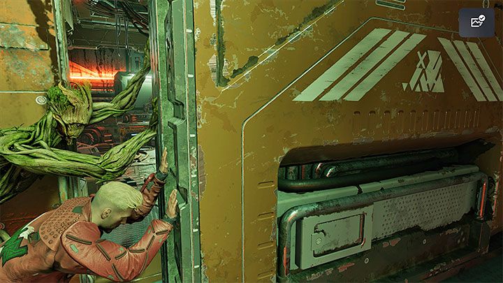 Po obejrzeniu scenek przerywnikowych zlokalizujcie najpierw boczne przejście, które prowadzi do sekretnego obszaru z sekretem Strój: Guardians of the Galaxy 2014 - Groot - Guardians of the Galaxy: Prolog i rozdział 1 - solucja, opis przejścia - Guardians of the Galaxy - poradnik do gry