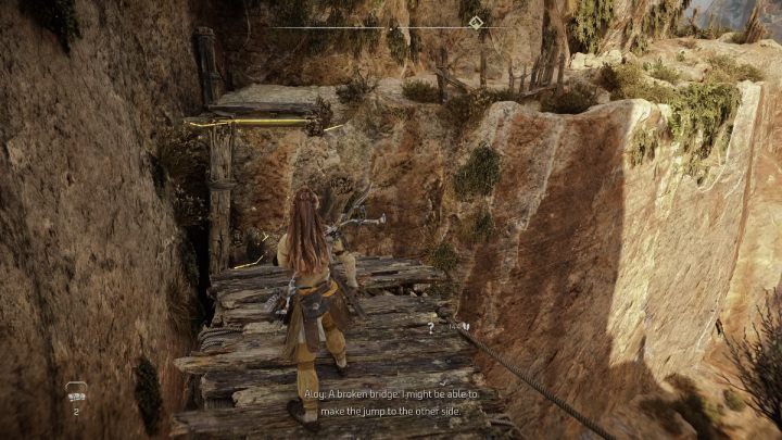 Biorąc rozbieg przeskoczcie przez złamany most i podążajcie wzdłuż skalnej ściany - Horizon Forbidden West: Droga Zmierzchu (The Twilight Path) - solucja, opis - Horizon Forbidden West - poradnik do gry