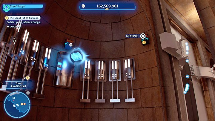 Poszukiwana znajdźka lewituje na dużej wysokości przy jednej ze ścian hangaru - LEGO Skywalker Saga: Theed - lista wszystkich łamigłówek (cz. 1) - LEGO Skywalker Saga - poradnik do gry