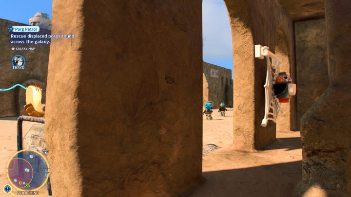 Porg znajduje się w pajęczynie na ścianie budynku - LEGO Skywalker Saga: Porgowy patrol (Porg Patrol) - solucja, opis przejścia - LEGO Skywalker Saga - poradnik do gry
