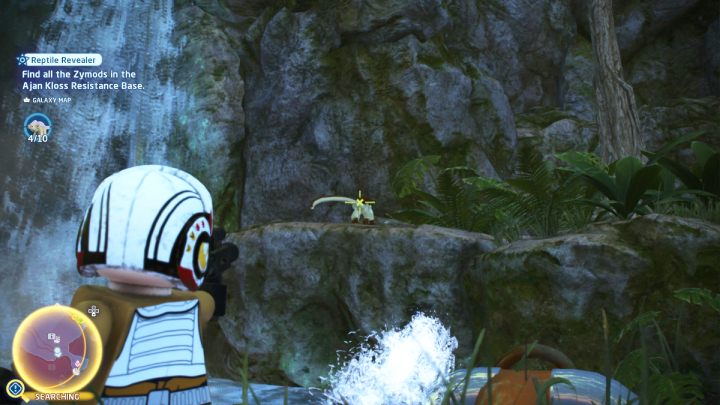 Brązowy kameleon stoi na skale przy wodospadzie - LEGO Skywalker Saga: Gonitwa za gadami (Reptile Revealer) - solucja, opis przejścia - LEGO Skywalker Saga - poradnik do gry