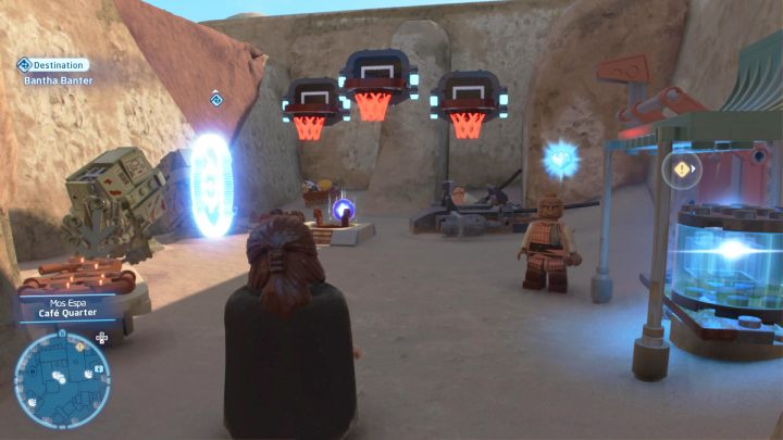 Aby rozpocząć grę w bumabol należy wejść w niebieski znacznik przy koszach w (Cafe Quarter) w północno wschodniej części Mos Espa - LEGO Skywalker Saga: Tatooine - próby, solucja, opis przejścia - LEGO Skywalker Saga - poradnik do gry