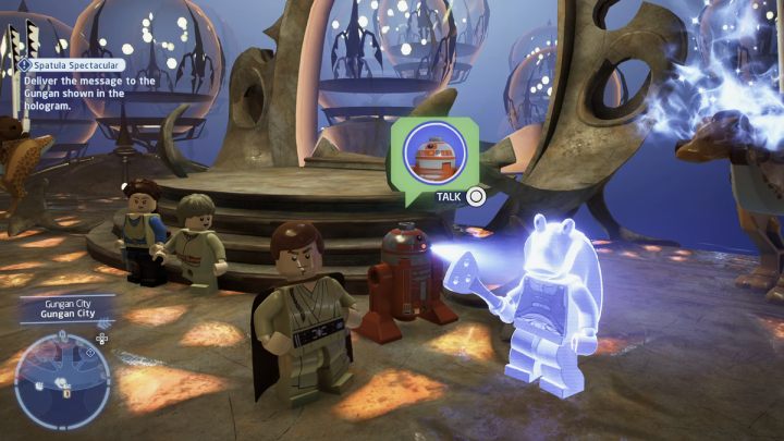 Porozmawiajcie z droidem przy główny wejściu miasta gungan - LEGO Skywalker Saga: Łopatkowe łajdactwa (Spatula Spectacular) - solucja, opis przejścia - LEGO Skywalker Saga - poradnik do gry