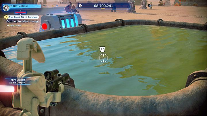 Znajdziecie zamkniętą skrzynkę ze znajdźką sąsiadującą z prostokątnym zbiornikiem - LEGO Skywalker Saga: Osada Niima (Niima Outpost) - lista wszystkich łamigłówek - LEGO Skywalker Saga - poradnik do gry