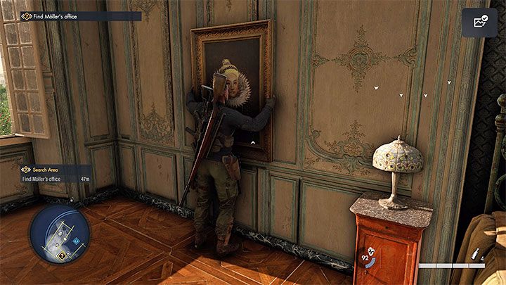 Wejdźcie teraz w interakcję z obrazem na ścianie żeby go przesunąć i odsłonić sejf - Sniper Elite 5: Odzyskanie skradzionych antyków (misja 2) - solucja, opis przejścia - Sniper Elite 5 - poradnik do gry