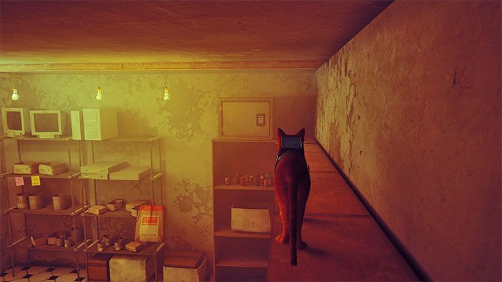 Doskoczcie do lady, a następnie wskoczcie do wnętrza sklepu, by rozpocząć jego eksplorację - Stray: Zagadka z sejfem w sklepie - Śródmiasto (Midtown) - Stray - poradnik do gry
