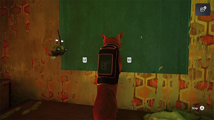 Wejdźcie w interakcję z roletą i drapcie ją do momentu jej zwinięcia się - Stray: Slumsy (The Slums), rozdział 4 - solucja, opis przejścia - Stray - poradnik do gry