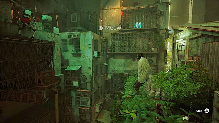 Na dachu pralni są 2 roboty, a jeden z nich rzuca puszkami z farbą - Stray: Ponczo (Poncho) dla Elliota w Slumsach (The Slums) - jak zdobyć? - Stray - poradnik do gry