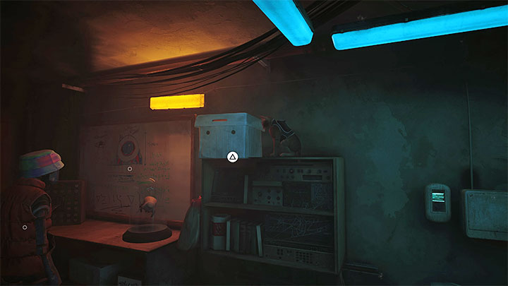 Możecie opcjonalnie przetłumaczyć tekst z tablicy oraz gazetę ze stołu - Stray: Slumsy - część 2 (The Slums - Part 2), rozdział 6 - solucja, opis przejścia - Stray - poradnik do gry