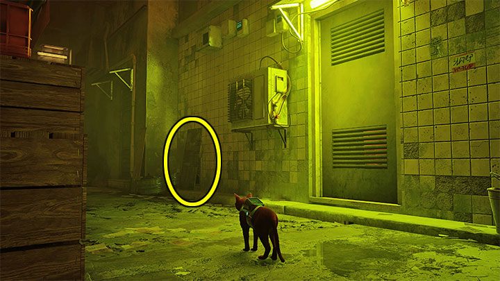 Mieszkanie Seamusa jest w oświetlonym na żółto budynku po prawej stronie - Stray: Mieszkanie Seamusa - gdzie znaleźć w slumsach (The Slums)? - Stray - poradnik do gry