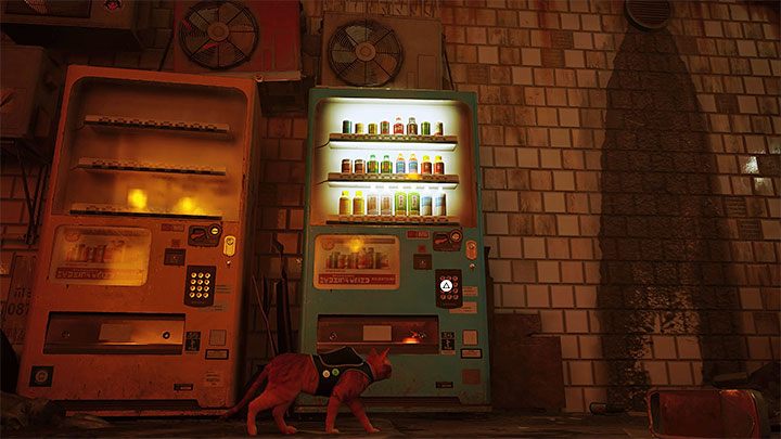 Drugi automat znajdziecie niedaleko siedzącego muzyka Morusquea - Stray: Automaty z napojami energetycznymi - gdzie są w Slumsach (The Slums)? - Stray - poradnik do gry