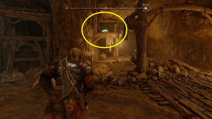 Ptak siedzi na drewnianej belce, niedaleko wielkich drzwi - God of War Ragnarok: Ogryzek (The Applecore), Svartalfheim - sekrety, znajdźki - God of War Ragnarok - poradnik do gry