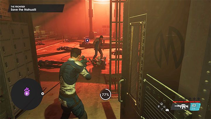 Możecie obejrzeć scenę po drugiej stronie szklanej ściany lub od razu wyruszyć z powrotem do sali z centralną klatką - Saints Row 2022: Pogranicze (The Frontier) - solucja, opis przejścia - Saints Row - poradnik do gry