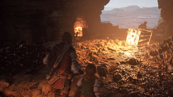 Skrzynię znajdziecie po przejściu przez obszar z wrakiem statku i po zbliżeniu się do kryjówki przemytników - Plague Tale Requiem: Sekretne skrzynie z rozdziału 7 (Przestępcy) - lista - A Plague Tale Requiem - poradnik do gry