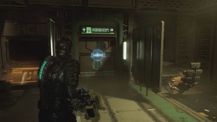 W drodze do laboratorium musicie przejść przez pomieszczenie Systemów żywienia (Nutrition Systems) - wejście do niego pokazuje dołączony obrazek - Dead Space Remake: Zamierzone zaniedbania (Premeditated Malpractice) - Dead Space Remake - poradnik do gry
