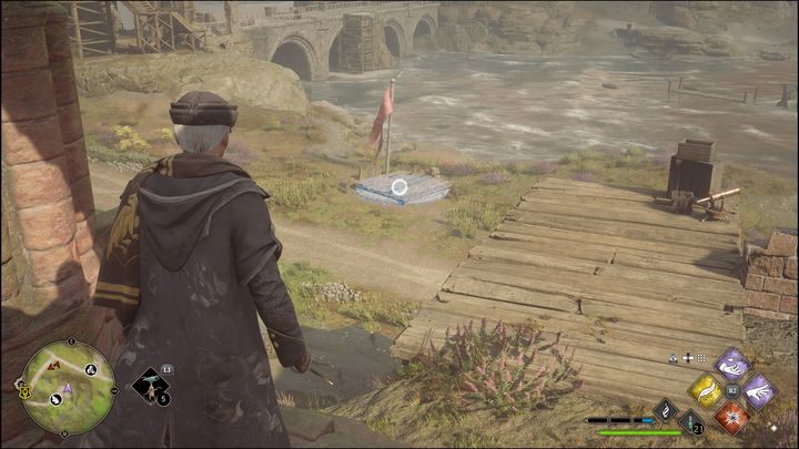 Będziecie musieli doprowadzić kulę do specjalnie dedykowanego miejsca - drewnianej kładki (na zdjęciu) - Hogwarts Legacy: Wybrzeże Kłusowników - wszystkie Łamigłówki Merlina - Hogwarts Legacy - poradnik do gry